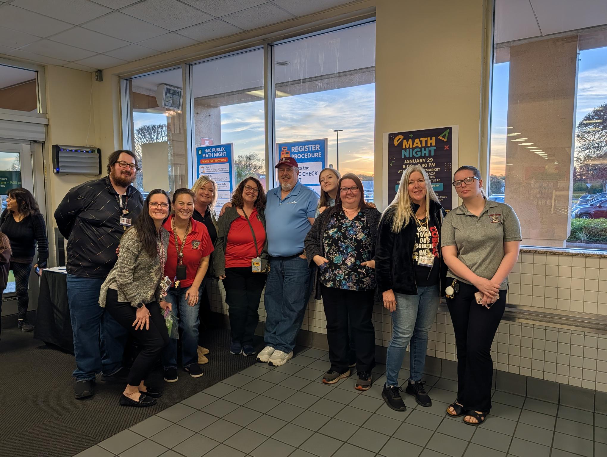 Staff enjoying using their math skills! - <p>Families and Staff enjoyed using math to solve real world problems at Publix!</p>