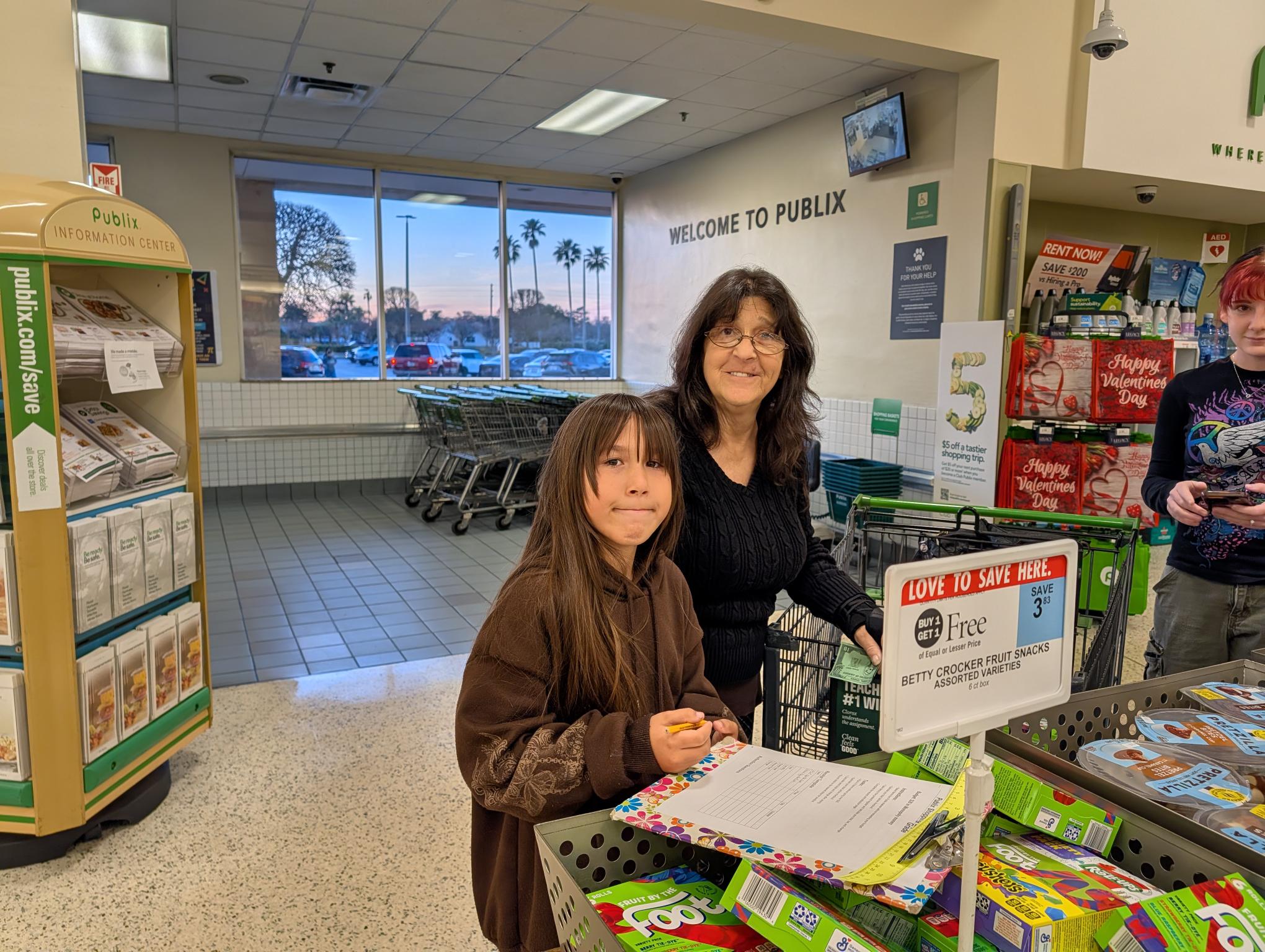 Families enjoying using their math skills! - <p>Families and Staff enjoyed using math to solve real world problems at Publix!</p>